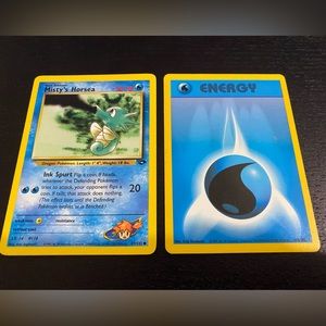 Misty’s Horsea 87/132 Pokemon Card with a Water Energy Card 102/102